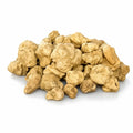 Truffes blanches fraîches de grande taille Tuber magnatum à la surface naturellement irrégulière, de couleur ocre pâle