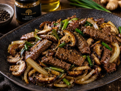 Sauté de bœuf au poivre noir, champignons et sauce à la Truffe