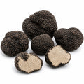 Truffes fraîches Tuber aestivum de catégorie A, entières et coupées, à l’intérieur noisette clair et finement marbré