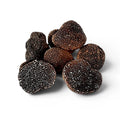Truffes fraîches Tuber melanosporum de catégorie EXTRA, dont un spécimen coupé révélant un intérieur marbré foncé
